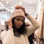 Black young woman doing shopping in a store